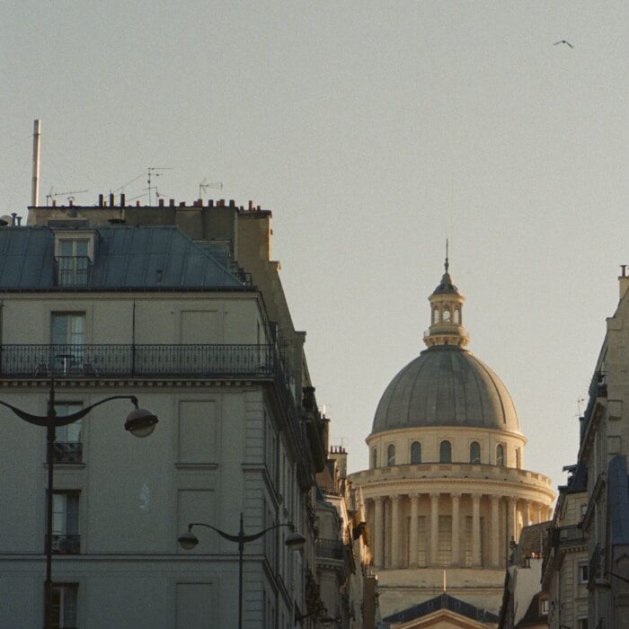 a street with cars and buildings on either side of it